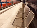 Empty metallic chairs during German Corona Lockdown in an U Bahn stations Royalty Free Stock Photo