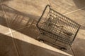 Empty miniature shopping cart