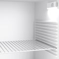 Empty minibar refrigerator inside Royalty Free Stock Photo