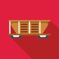 Empty mining wagon standing on rails on red background
