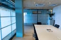 Empty modern board room with conference table and glass walls in office Royalty Free Stock Photo