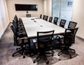 Empty modern boardroom table and chairs Royalty Free Stock Photo