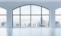 An empty modern bright and clean loft interior. Huge panoramic windows with New York city view. A concept of luxury open space for Royalty Free Stock Photo