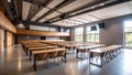 Empty modern classroom with rows of desks and chairs, natural light Royalty Free Stock Photo