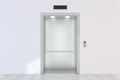 An empty modern elevator or lift with metal doors that are open Royalty Free Stock Photo