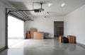 Empty modern garage interior with open door bright light. Cardboard boxes storage containers and sink are present. Room is clean Royalty Free Stock Photo