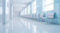 Empty modern hospital corridor, clinic hallway interior background with white chairs for patients waiting for doctor visit Royalty Free Stock Photo