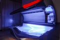 Empty modern tanning bed in room of luxury hotel