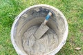 Empty mortar bucket with a trowel