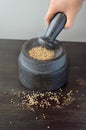 An empty mortar and pestle from above on a timber background