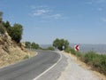 Empty mountain road with traffic sign Royalty Free Stock Photo