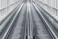 Empty moving escalator tracks by the station Royalty Free Stock Photo