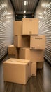 Empty moving truck interior shows boxes neatly stacked with folded blankets in the foreground, ready for relocation Royalty Free Stock Photo