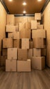Empty moving truck interior shows boxes neatly stacked with folded blankets in the foreground, ready for relocation Royalty Free Stock Photo
