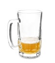 Almost empty mug of cold beer on white background Royalty Free Stock Photo