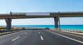 Empty Highway Overpass with Ocean View and Clear Blue Sky on a Sunny Day road Royalty Free Stock Photo