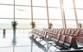 Empty multiple rows of seats in a waitng hall at the airport departure terminal Royalty Free Stock Photo