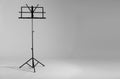 Empty music note stand on grey background. Royalty Free Stock Photo
