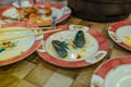 Empty mussels on the table after dinner in Asia