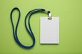 Empty name tag with white strap, mockup on green background