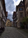 Empty narrow alley with cobblestone in the historic center of Esslingen with old buildings and half-timbered houses. Royalty Free Stock Photo
