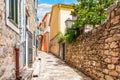 Empty narrow medieval European street in the Old Town of Herceg Novi, Montenegro Royalty Free Stock Photo