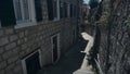 Empty narrow street of the old masonry town in Montenegro, in Herceg Novi Royalty Free Stock Photo
