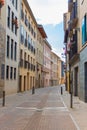 Empty narrow street in old town, Spain. Traditional facade of buildings in small town in Europe. Royalty Free Stock Photo