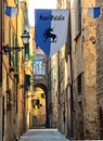 Empty narrow streets in the ancient small mediterranean village Albenga in Liguria Italy preparing for a holiday
