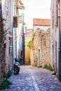 Empty, narrow streets in Croatia with scooter Royalty Free Stock Photo