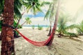 Empty net hammock at tropical beach resort Royalty Free Stock Photo