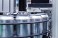 Empty new aluminum cans for drink process are moving in factory line on conveyor belt machine at beverage manufacturing. food and Royalty Free Stock Photo