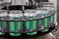 Empty new aluminum cans for drink process are moving in factory line on conveyor belt machine at beverage manufacturing. food and Royalty Free Stock Photo