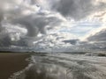 Empty North Sea beach in the Netherlands on a gray cloudy day.