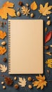 Empty note pad with autumn leaves and copy space Royalty Free Stock Photo