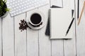 Empty notebook, computer and coffee on table Royalty Free Stock Photo