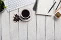 Empty notebook, computer and coffee on wooden table Royalty Free Stock Photo