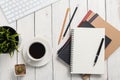 Empty notebook, computer and coffee on wooden table Royalty Free Stock Photo