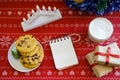 Empty notebook for desires and Christmas cookies with chocolate on a red napkin