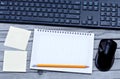 Empty notebook with keyboard pc mouse and notes Royalty Free Stock Photo