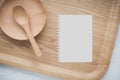 Empty notebook and kitchen utensils Royalty Free Stock Photo