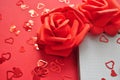 empty notebook next to red roses Royalty Free Stock Photo
