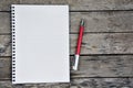 Empty notebook page on a wooden table