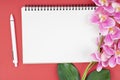 Empty notebook and pen with pink orchid Royalty Free Stock Photo