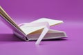 empty notebook on purple background Royalty Free Stock Photo