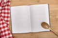 Empty notebook for recipes with spoon and Royalty Free Stock Photo