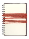 Empty notebook wrap with red cord on white background
