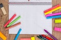 Empty notepad with color chalks and pencils Royalty Free Stock Photo