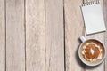 Empty notepad and hot coffee on desk, top view, copy space Royalty Free Stock Photo