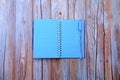 Empty notepad with pencil on wooden background Royalty Free Stock Photo